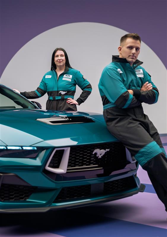 Designers Kristen Keenan and Stefan Taylor alongside the 2026 Mustang FX Package. Preproduction model shown with optional equipment and extra cost color.